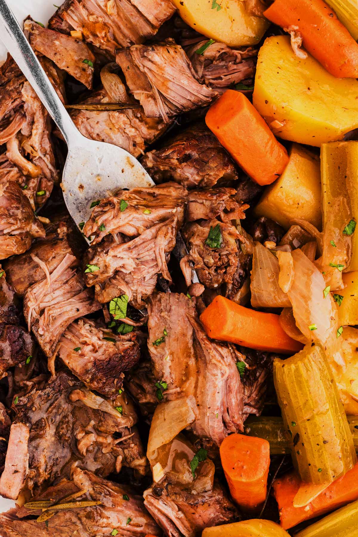 overhead view of crockpot pot roast with fork