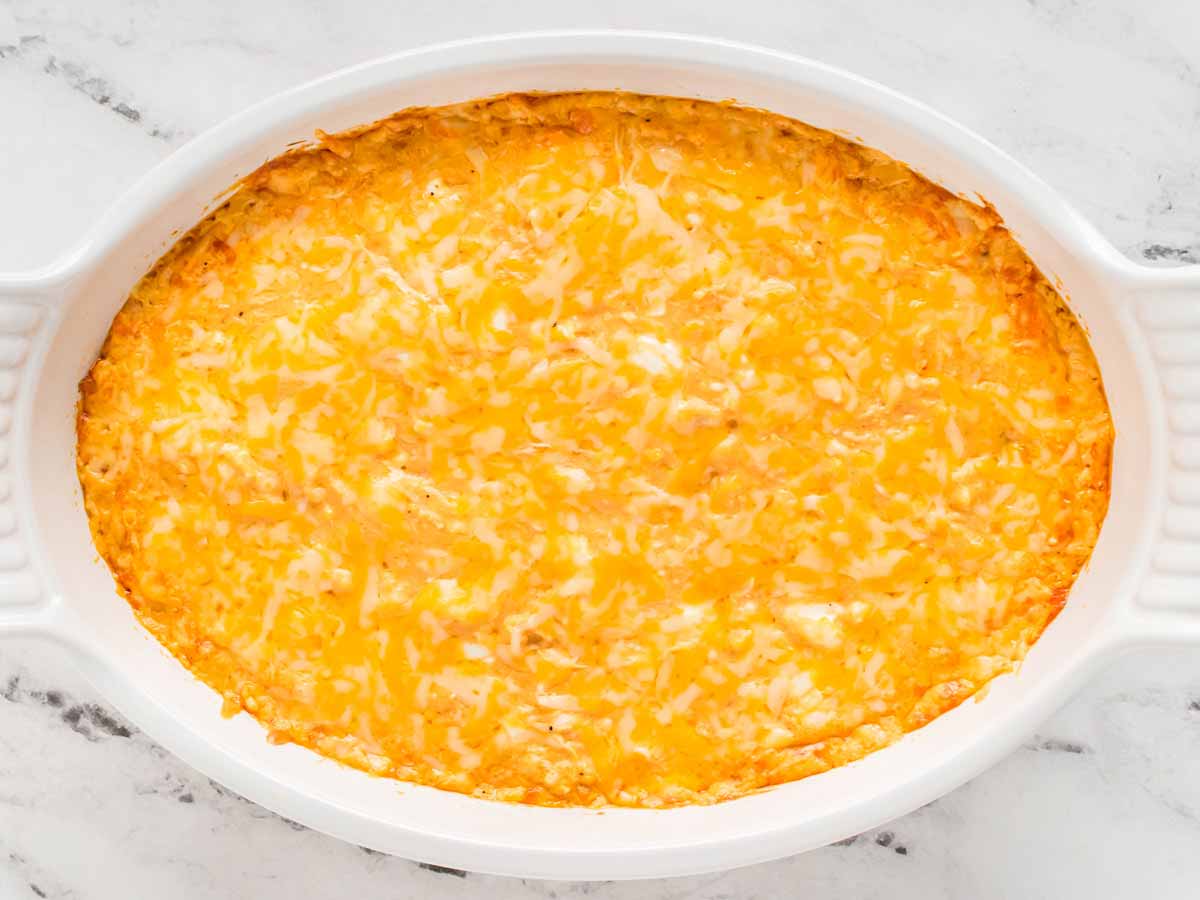 overhead view of baked buffalo chicken dip in white dish