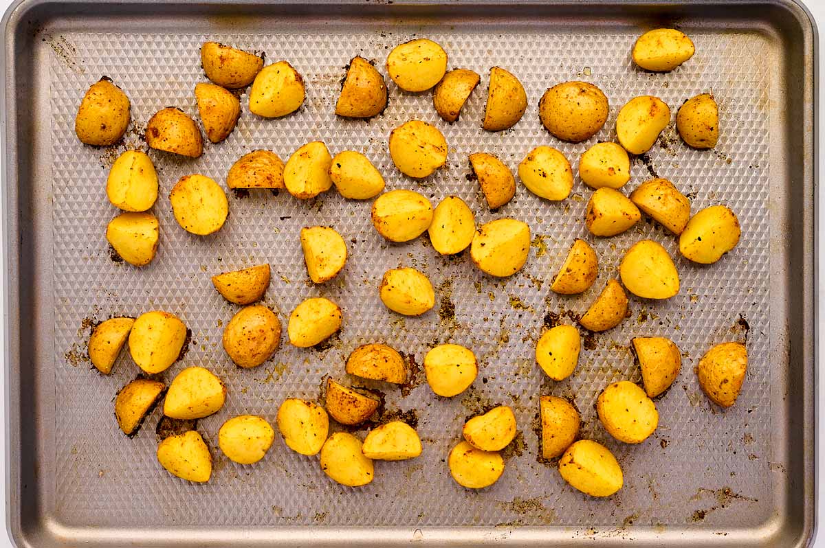 overhead view of roasted potatoes on sheets pan