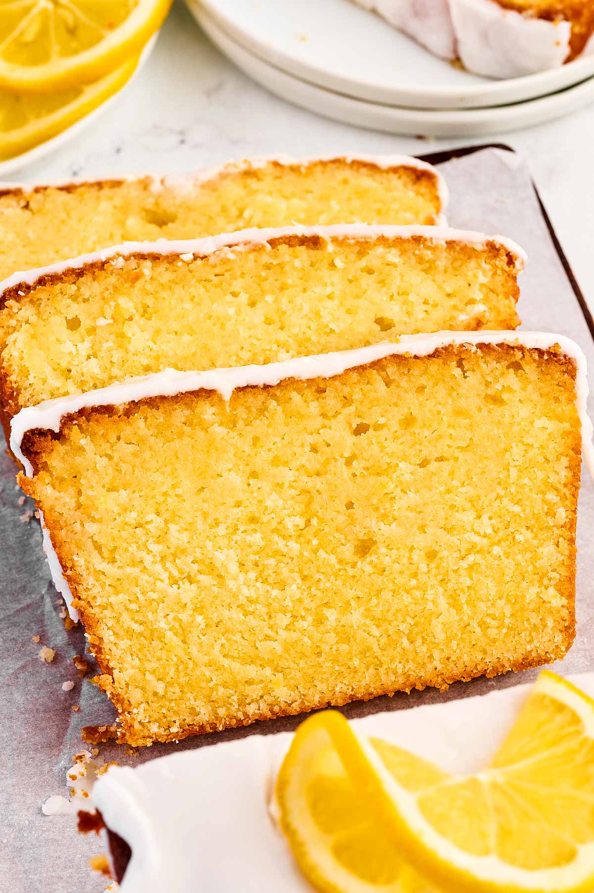 frontal view of three slices of lemon loaf pound cake