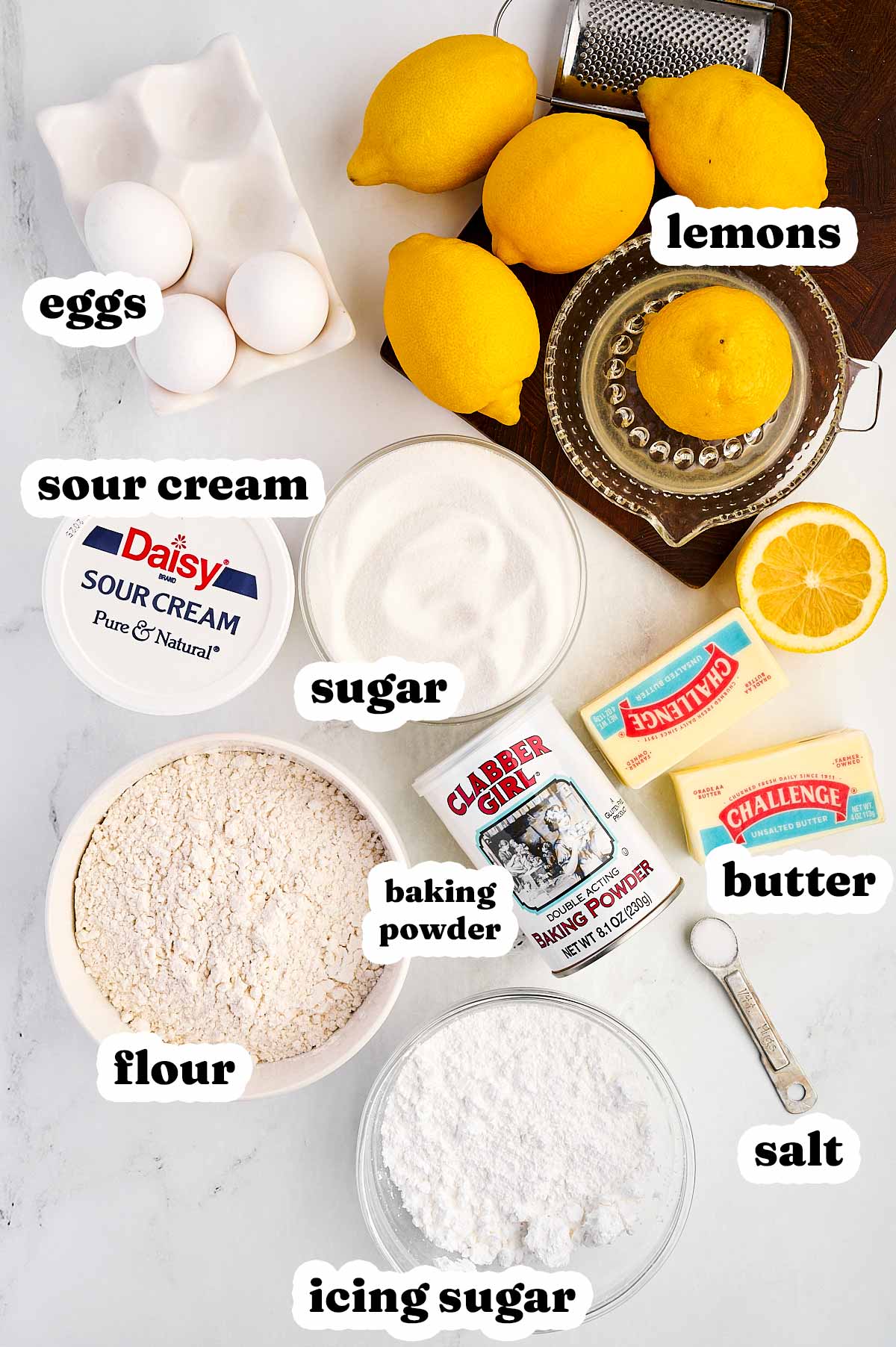 overhead view of ingredients to make lemon loaf pound cake with text labels