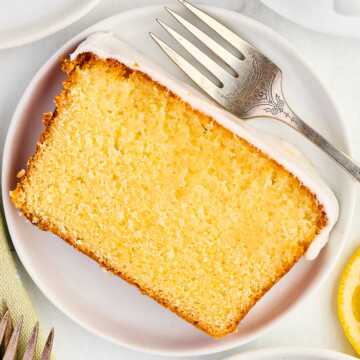 overhead view of lemon loaf pound cake slice on white plate