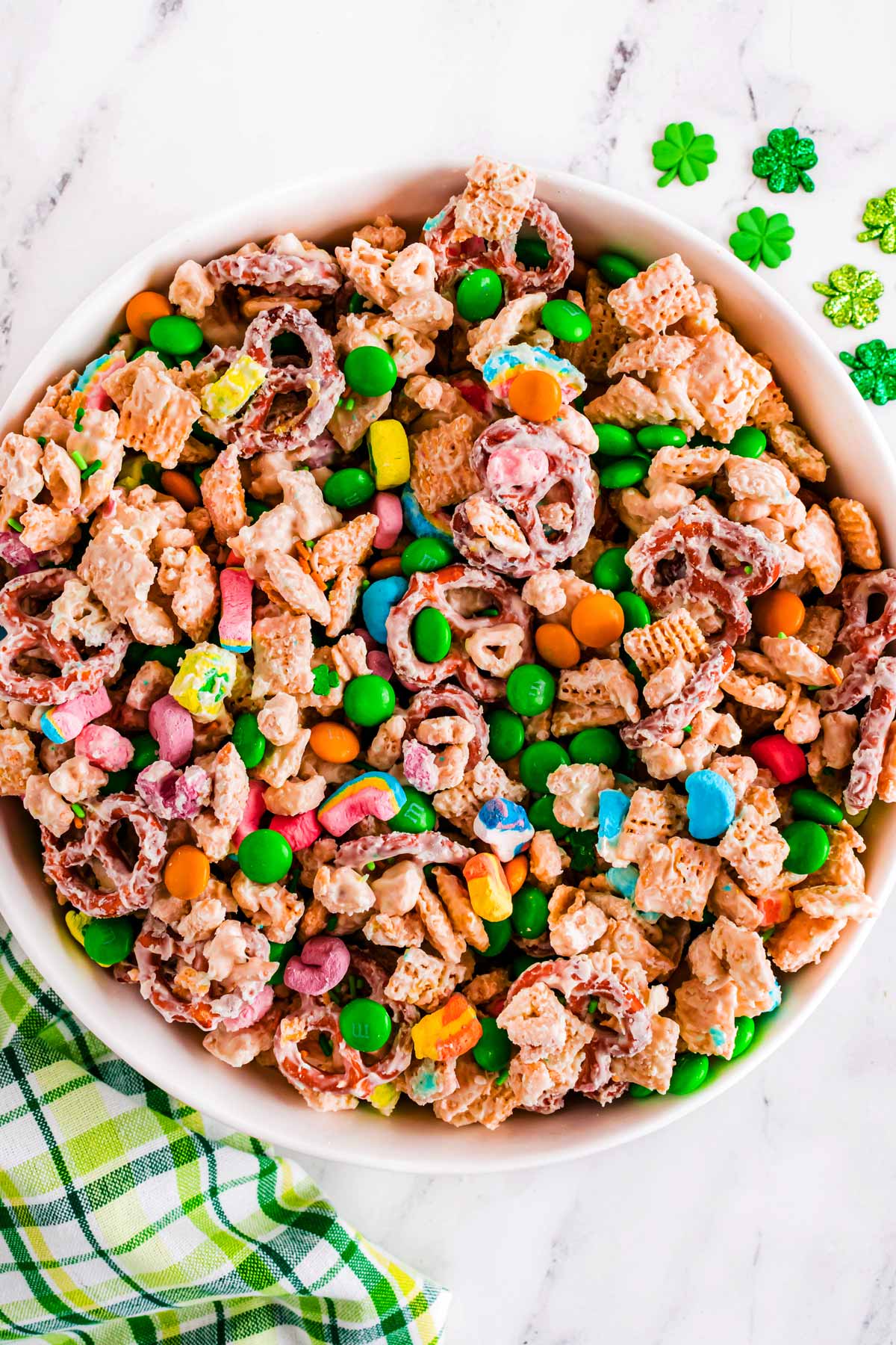 overhead view of leprechaun bait Chex mix in white bowl