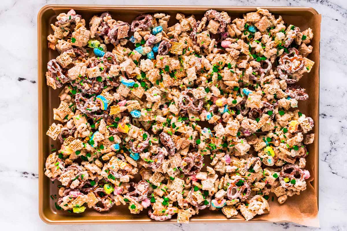 overhead view of leprechaun Chex mix on baking sheet without candy