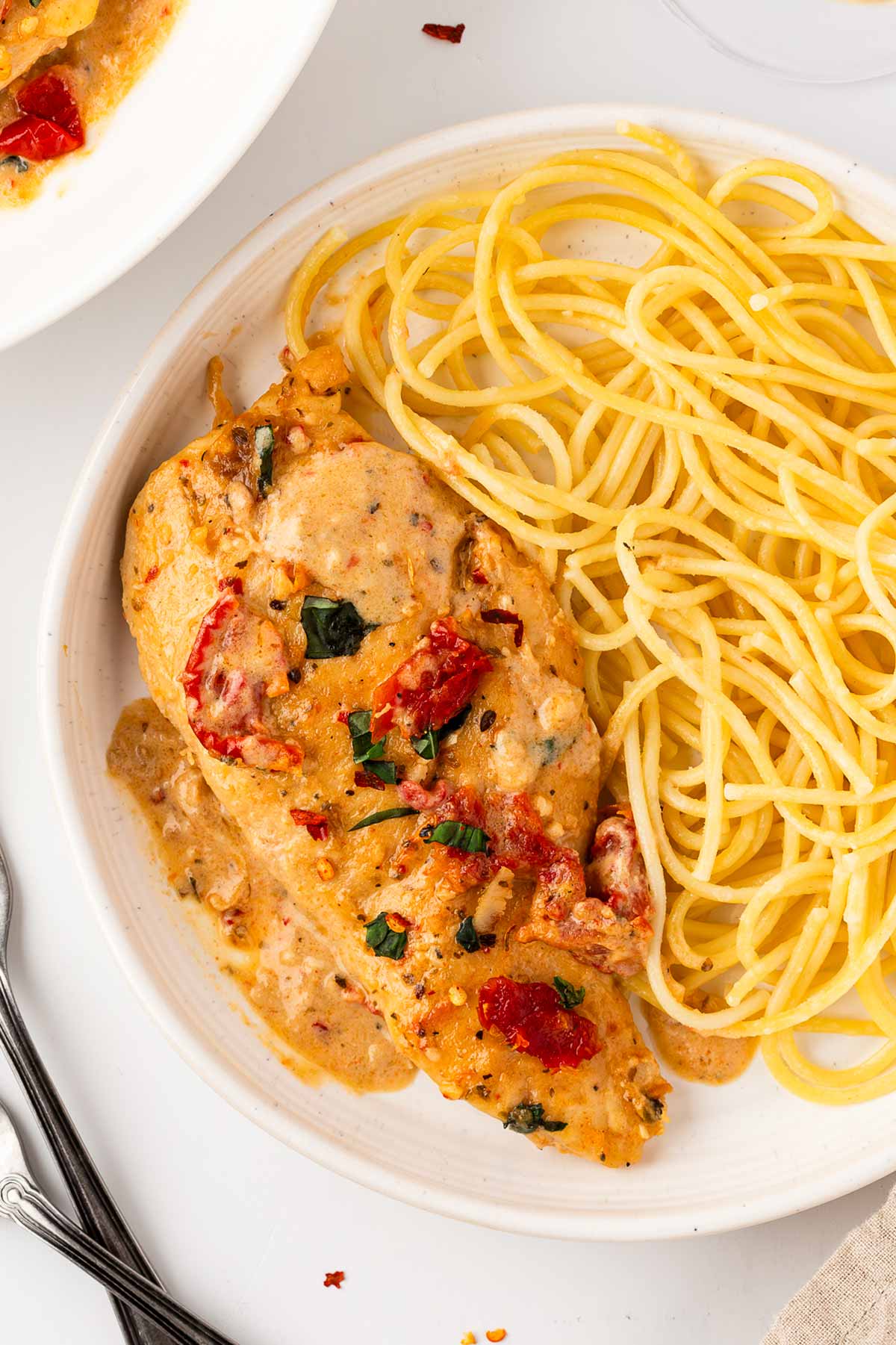 overhead view of marry me chicken on plate with spaghetti