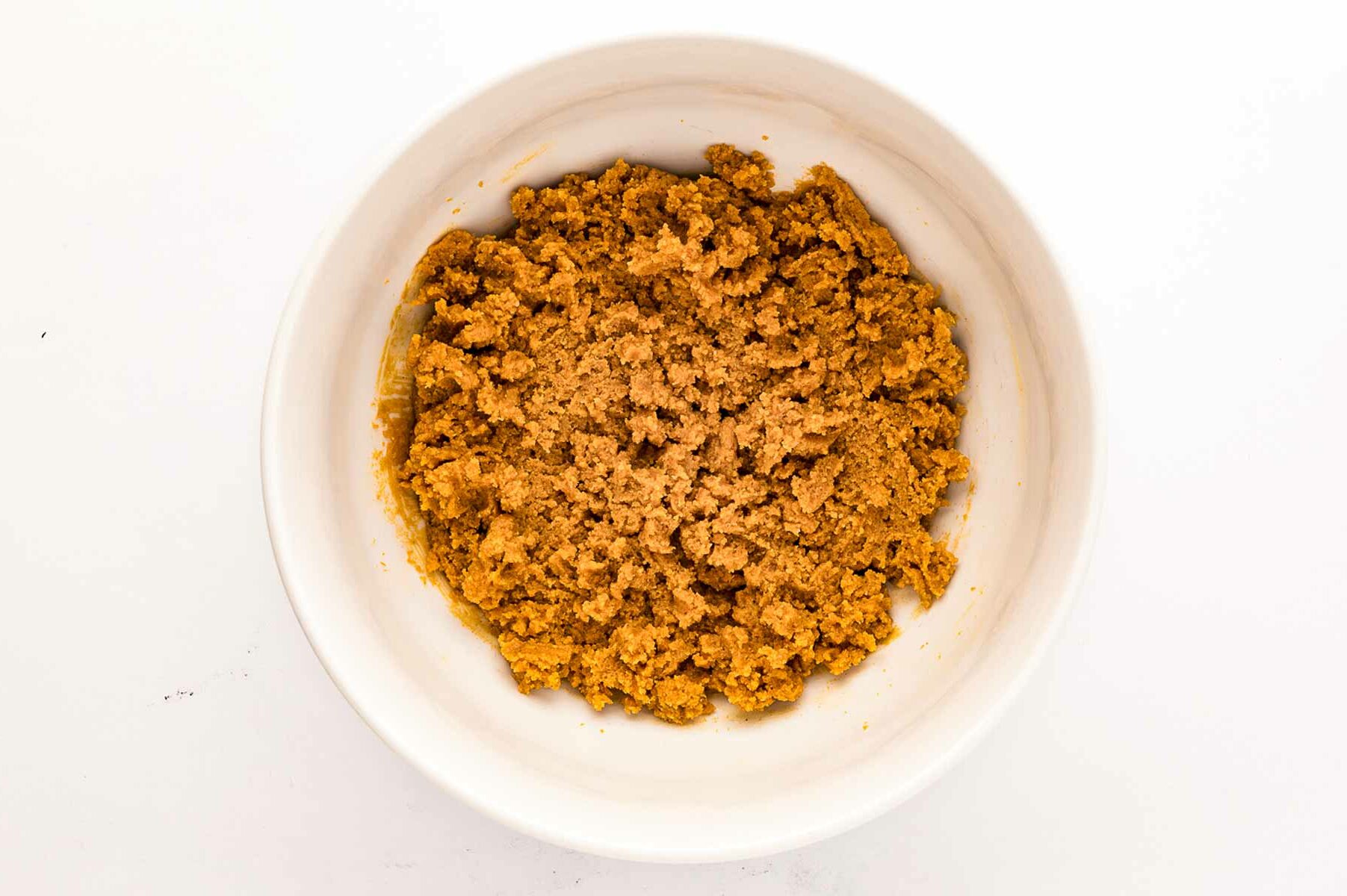 overhead view of peanut butter cookie dough in white bowl