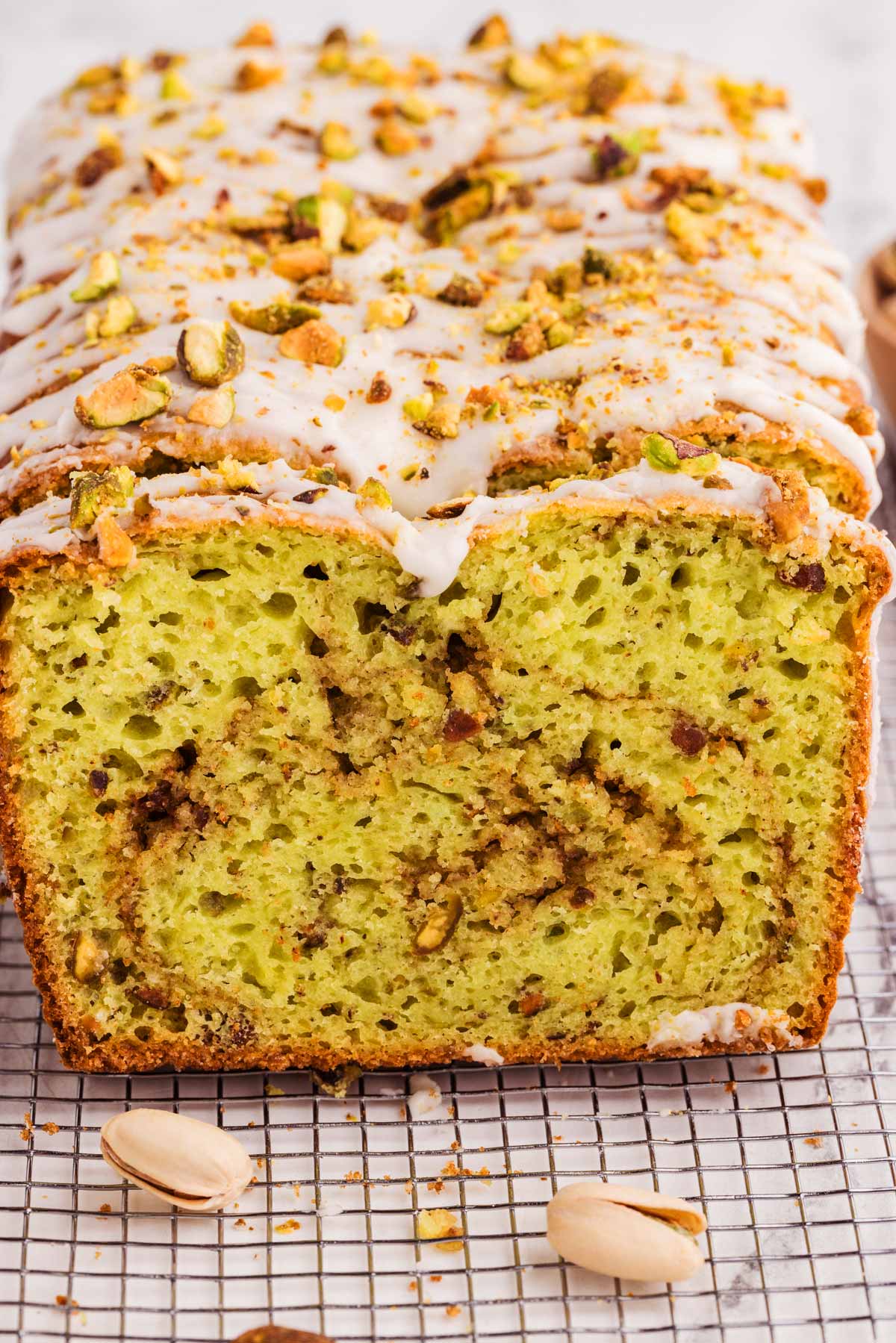 frontal view of sliced pistachio bread