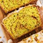 close-up of a slice of pistachio bread showing its soft texture and chopped pistachios