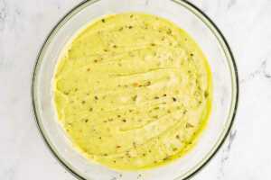 overhead view of pistachio bread batter in a large mixing bowl