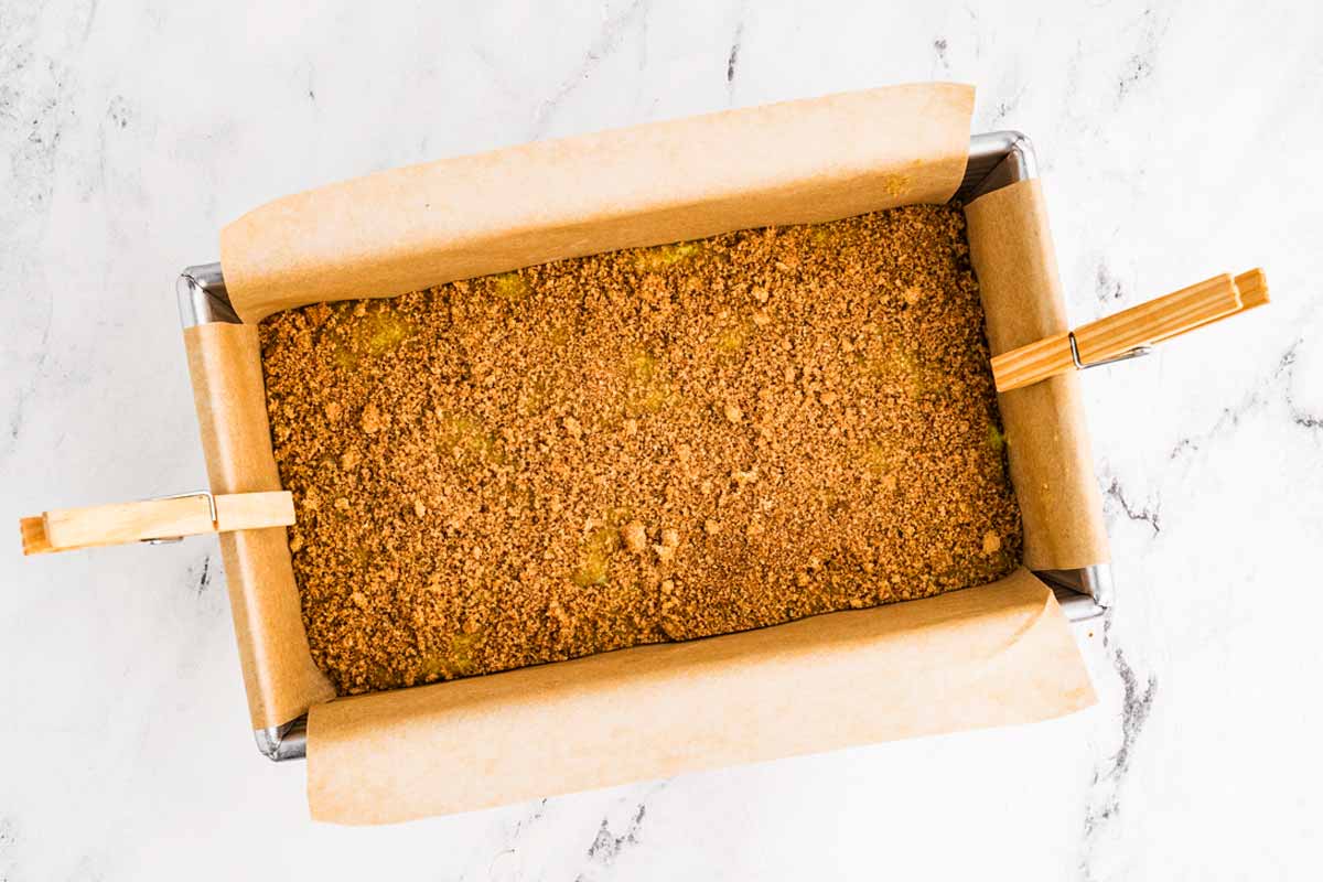 overhead view of cinnamon-sugar sprinkled over bread batter in the loaf pan