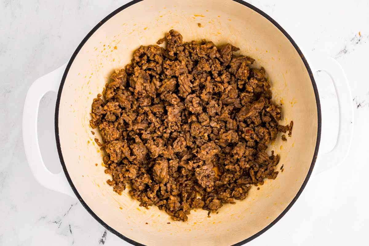 overhead view of browned sausage in pot