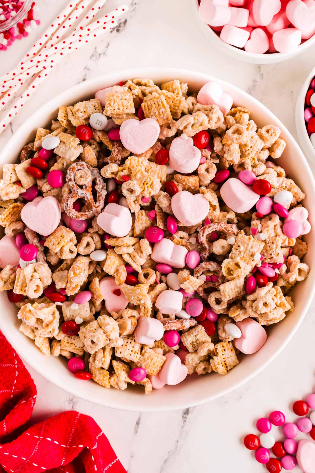 overhead view of valentine's treat mix in a white bowl