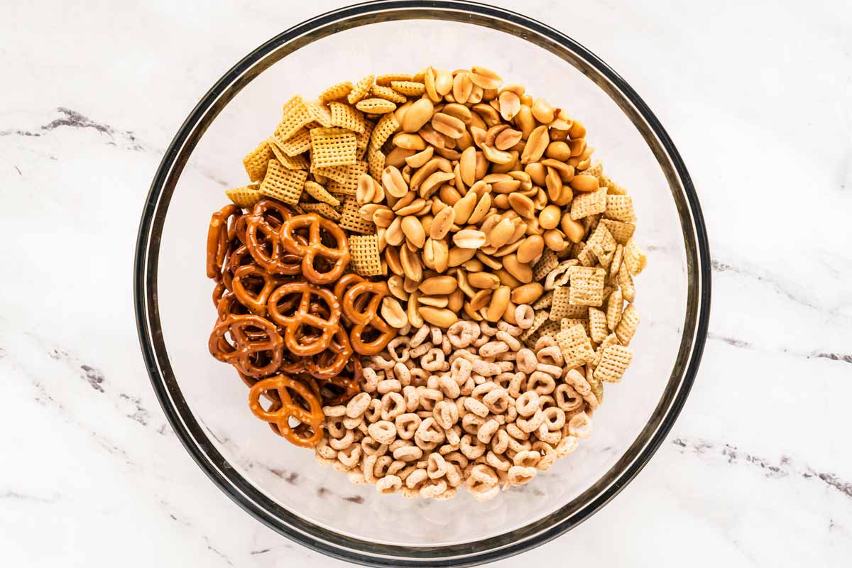 overhead view of dry ingredients for Chex mix in bowl