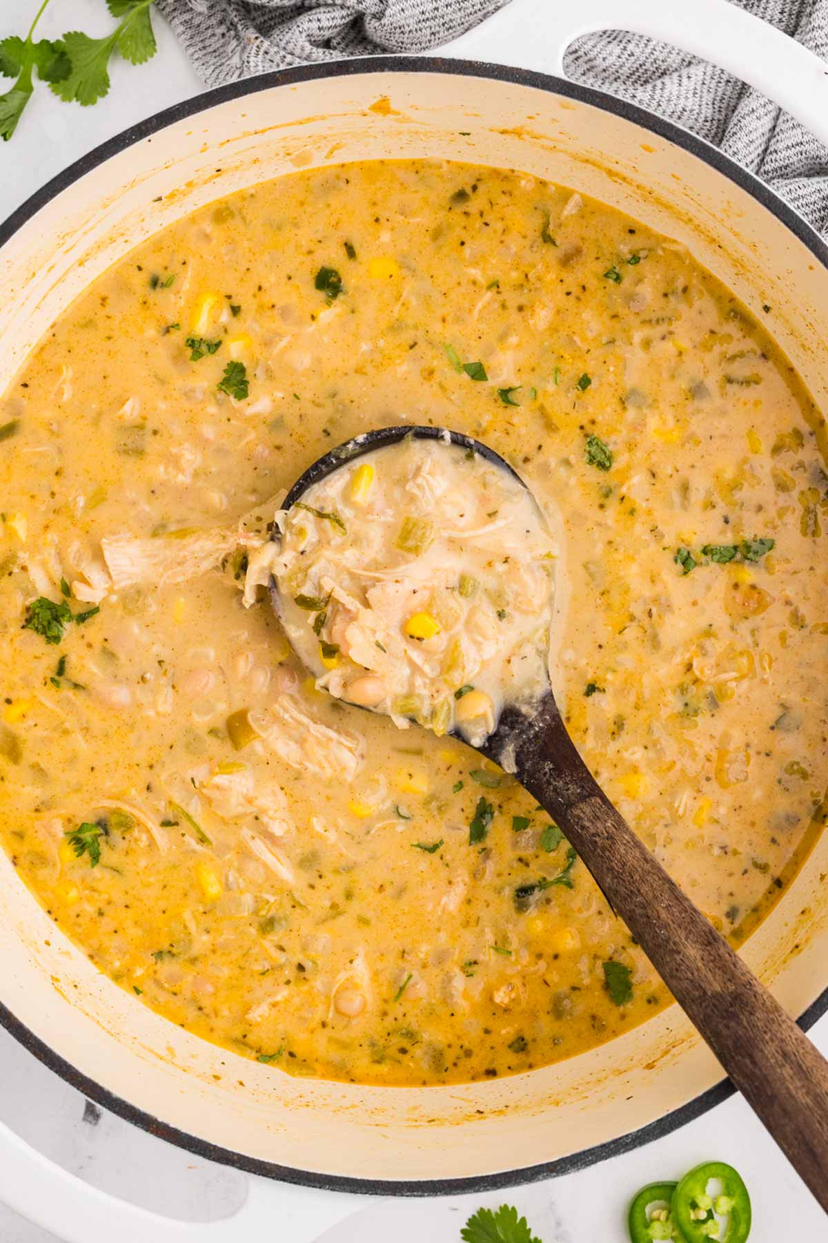 overhead view of pot of white chicken chili with label