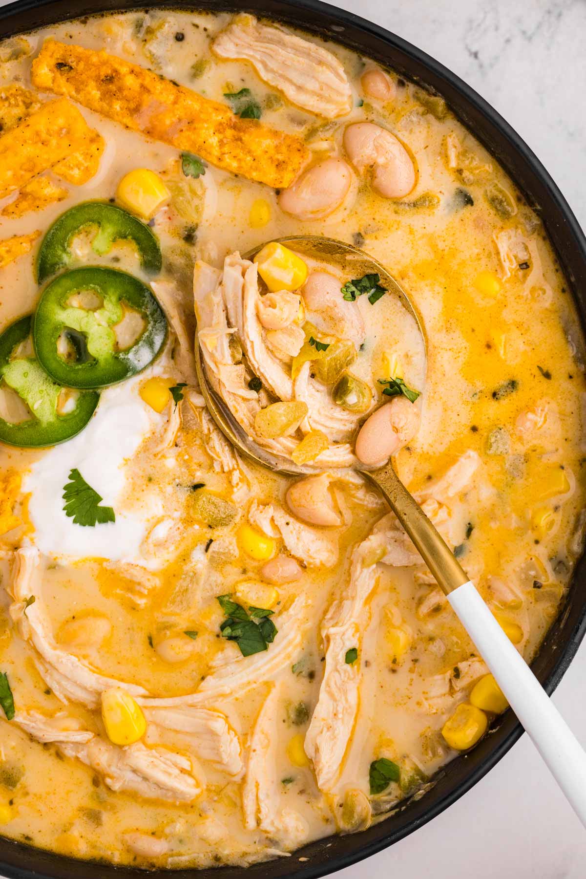 overhead view of white chicken chili in bowl