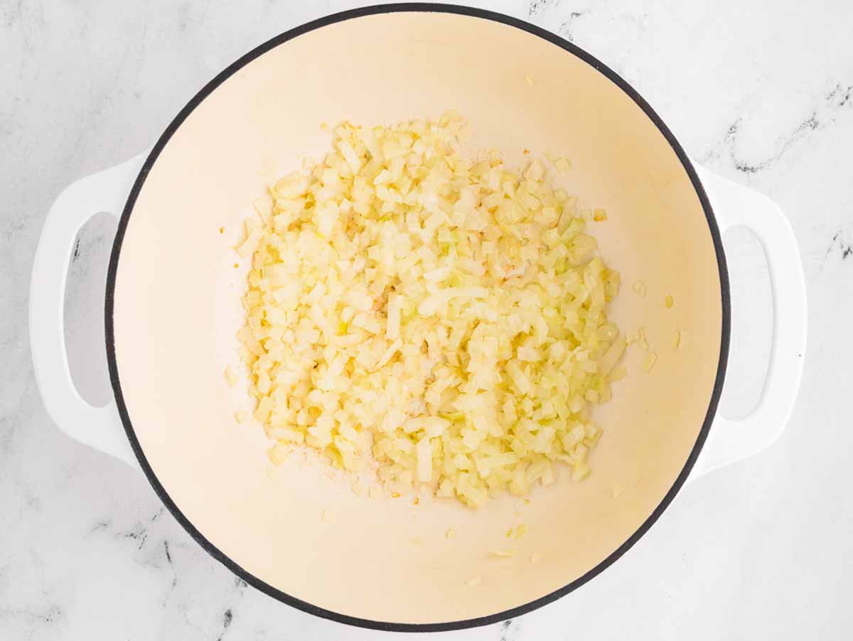 overhead view of sautéed onion in pot