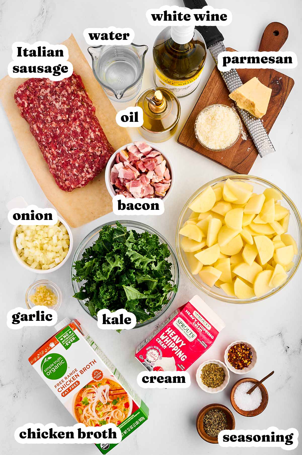 overhead view of ingredients to make Zuppa Toscana with text labels