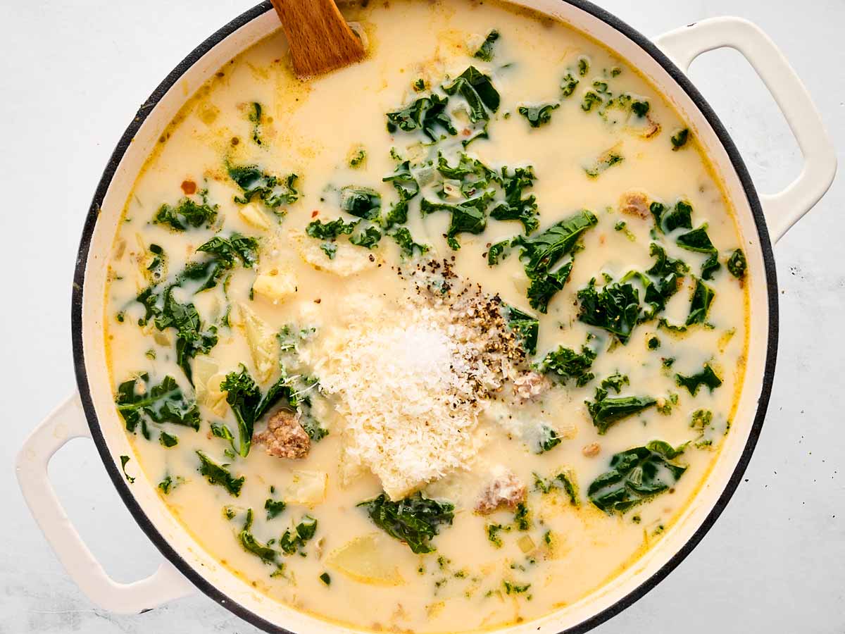 overhead view of Zuppa Toscana with parmesan in pot