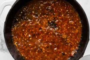 overhead view of stir fry sauce bubbling in pan