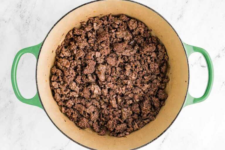 overhead view of soup pot filled with browned ground beef and pork