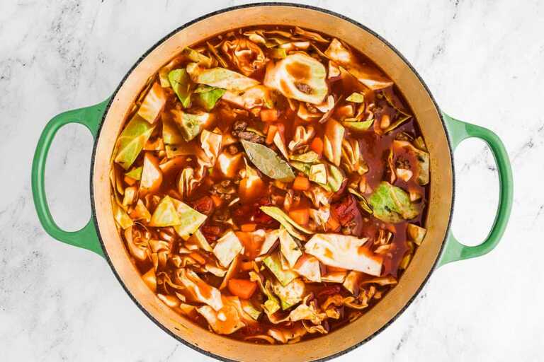 overhead view of soup pot filled with uncooked cabbage roll soup