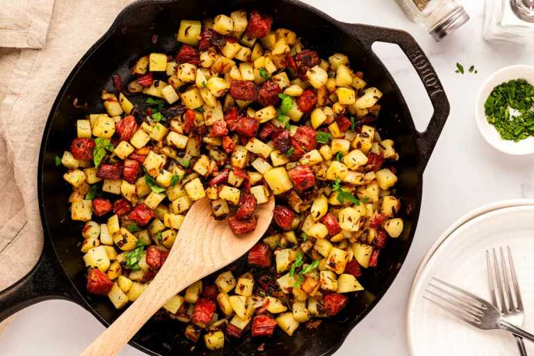 overhead view of corned beef hash in skillet with parsley