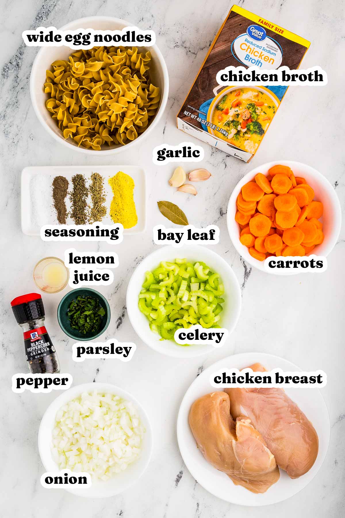 overhead view of ingredients to make chicken noodle soup with text labels