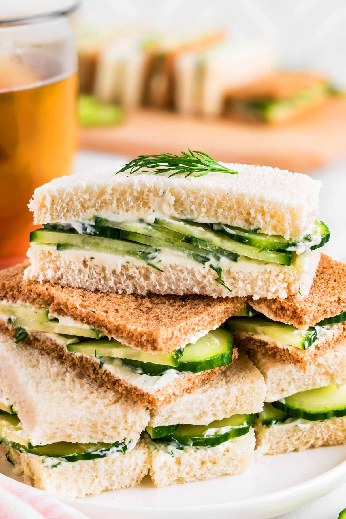 frontal view of stacked cucumber tea sandwiches