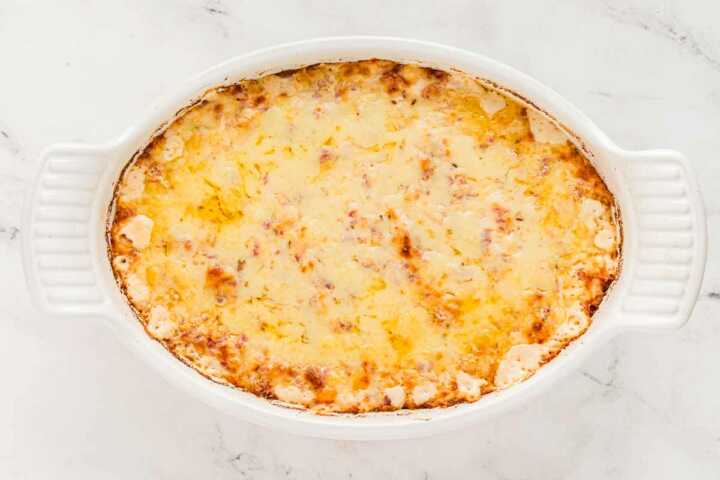 overhead view of baked reuben dip in white baking dish