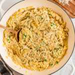 overhead view of garlic parmesan orzo in cast iron pan