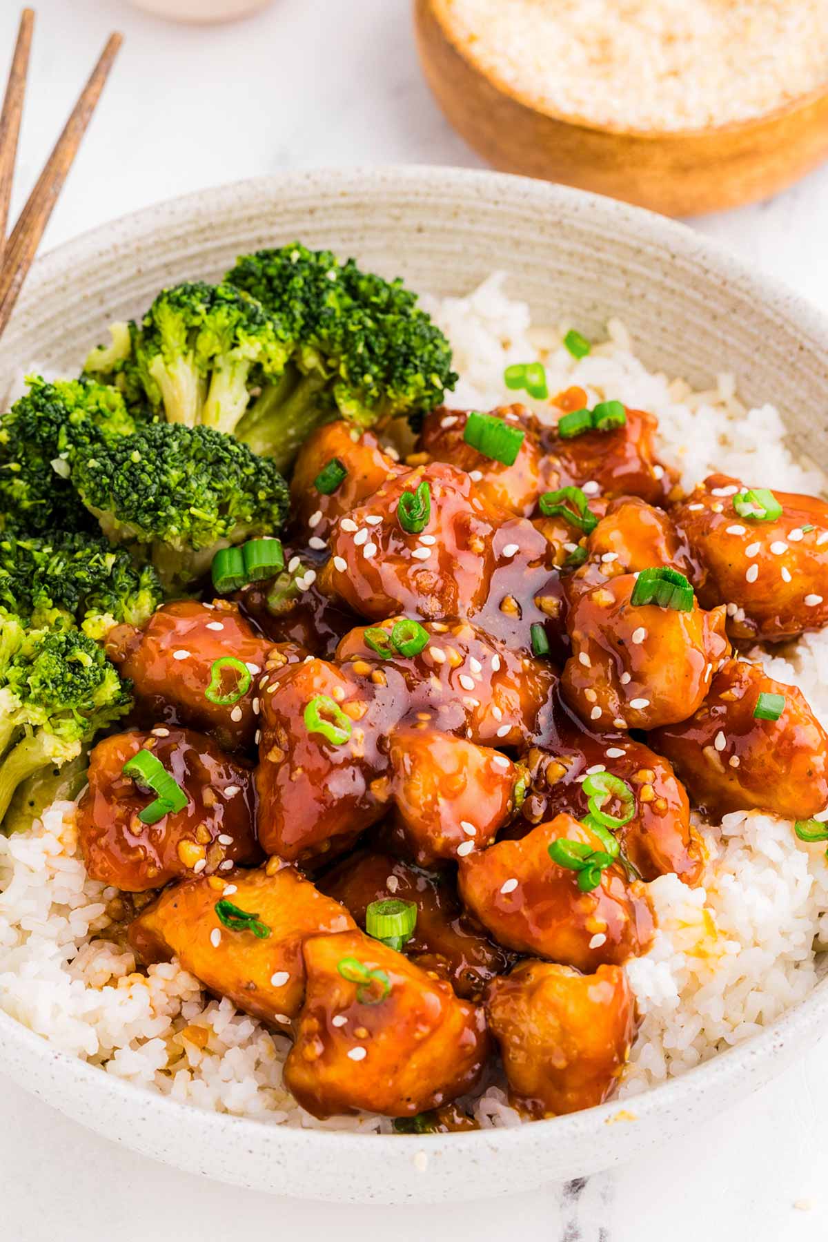 45° view of bowl filled with teriyaki chicken, rice and broccoli