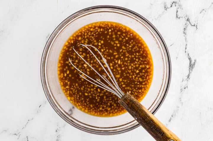 overhead view of teriyaki sauce in glass bowl