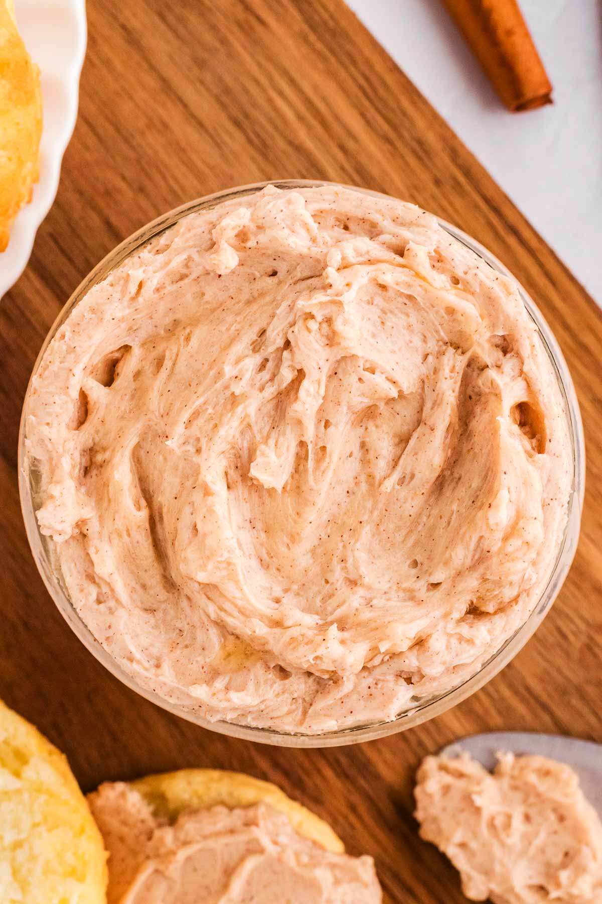 overhead view of cinnamon butter in mason jar on wooden board