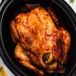 overhead view of whole chicken cooked in crockpot