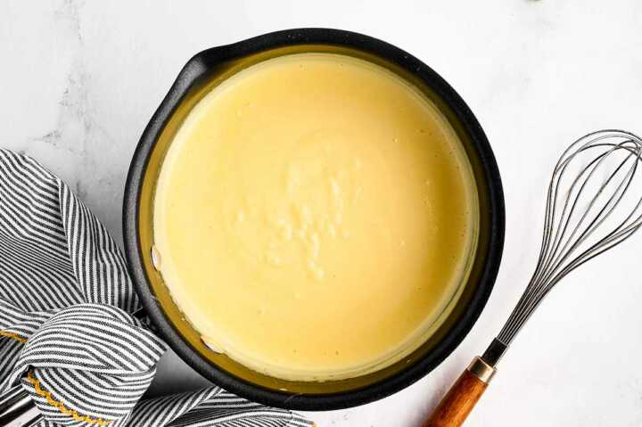 overhead view of ingredients for vanilla sauce in saucepan after cooking