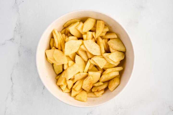 overhead view of sliced apples in bowl