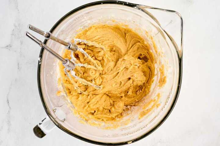 overhead view of cake batter in glass bowl