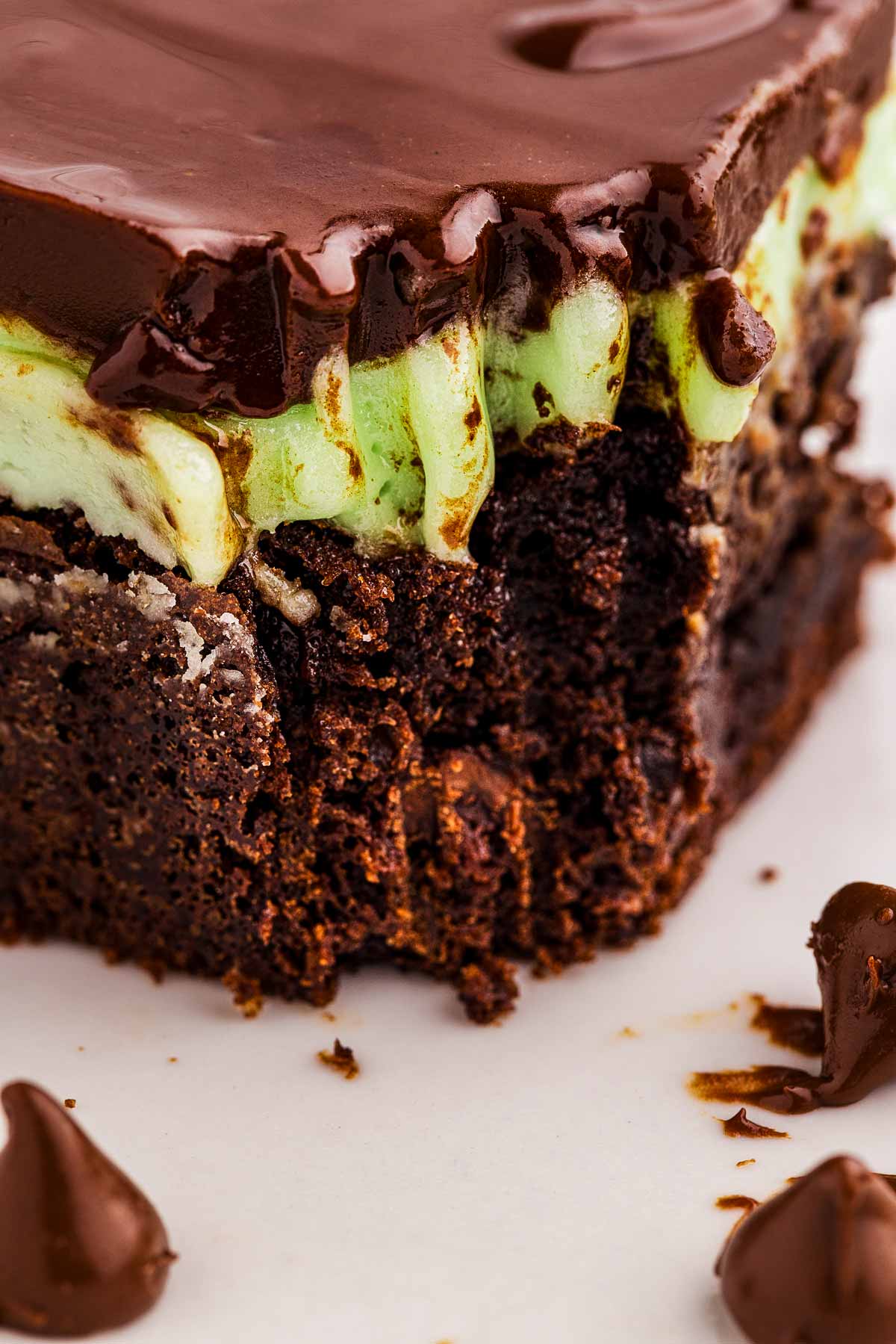 Frontal close up view of a mint brownie with a bite taken out