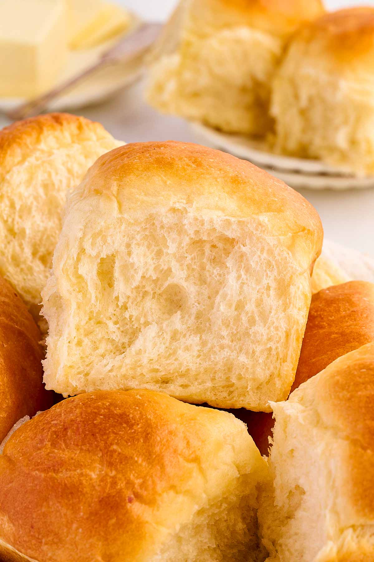 frontal view of potato dinner rolls stacked on top of each other