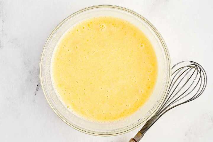 wet ingredients for potato rolls in glass bowl