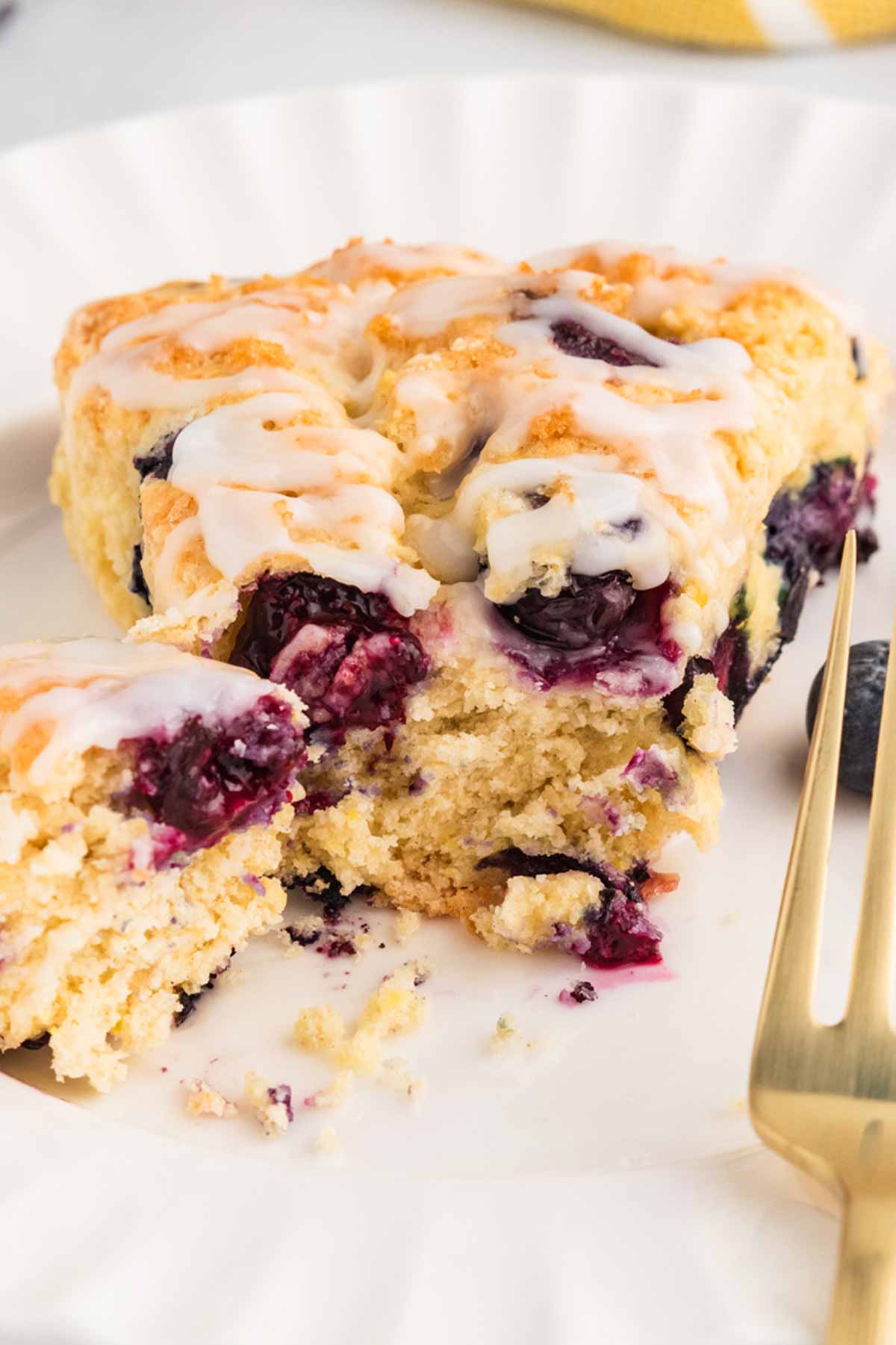 frontal view of scone on plate with bite taken out